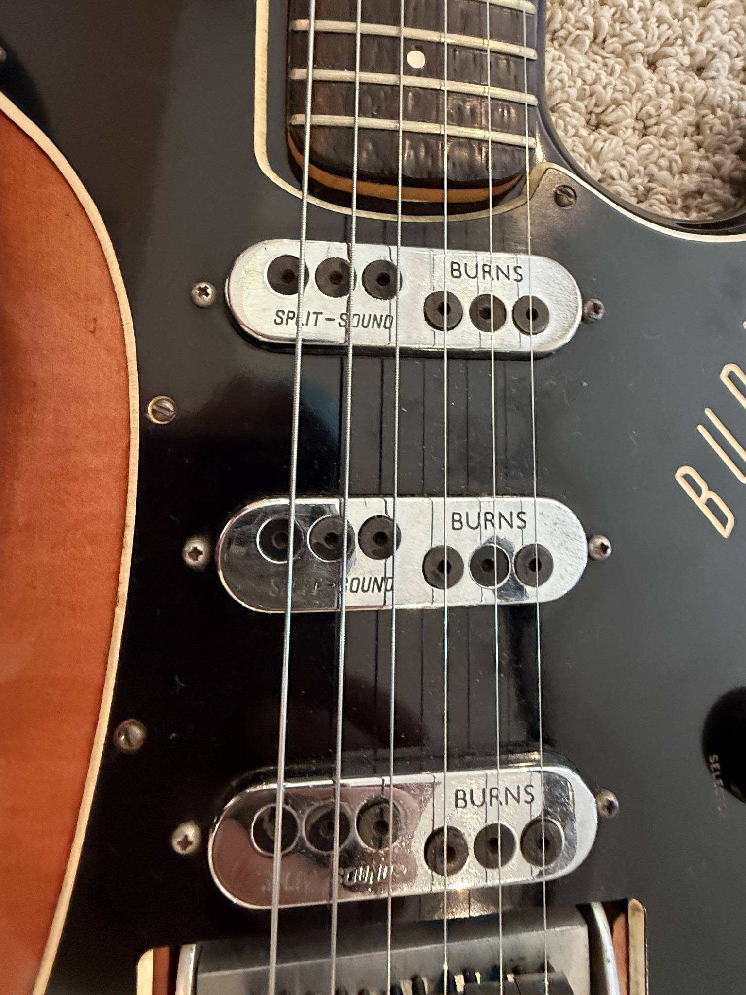 Burns Jazz Split Sound pickups and black pickguard on the restored sunburst guitar
